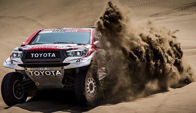 DUNE AND DUSTED: The three South African Toyota Hilux bakkies are ready to race. Image: Toyota SA